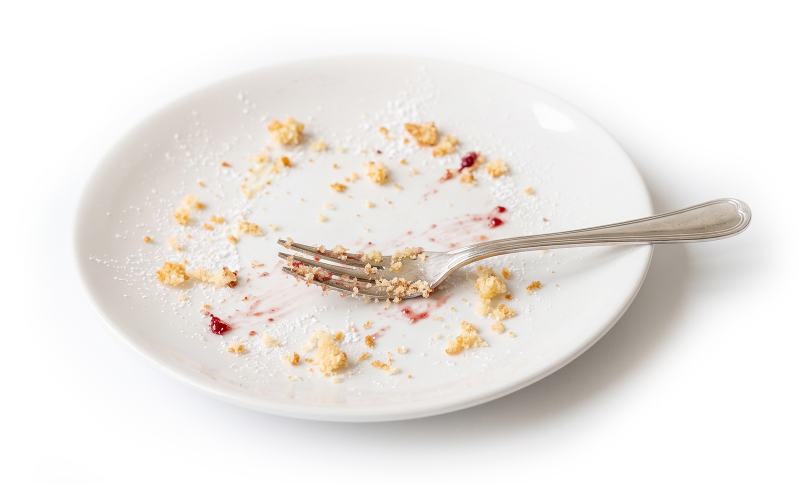 Empty plate with crumbs and fork.